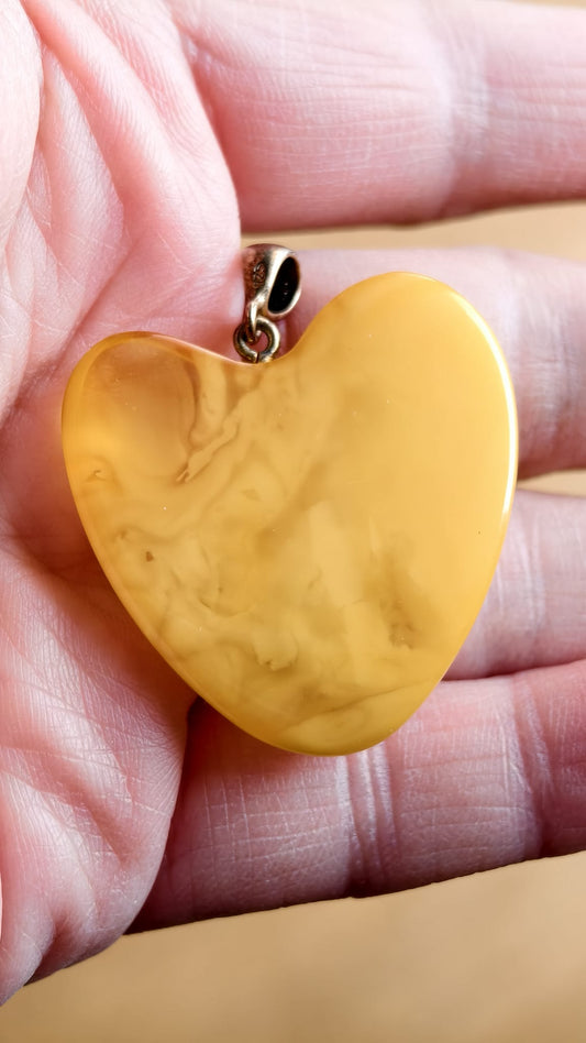 Handmade asymmetrical heart pendant made of genuine Baltic white amber with floating patterns 925 pendant without a chain