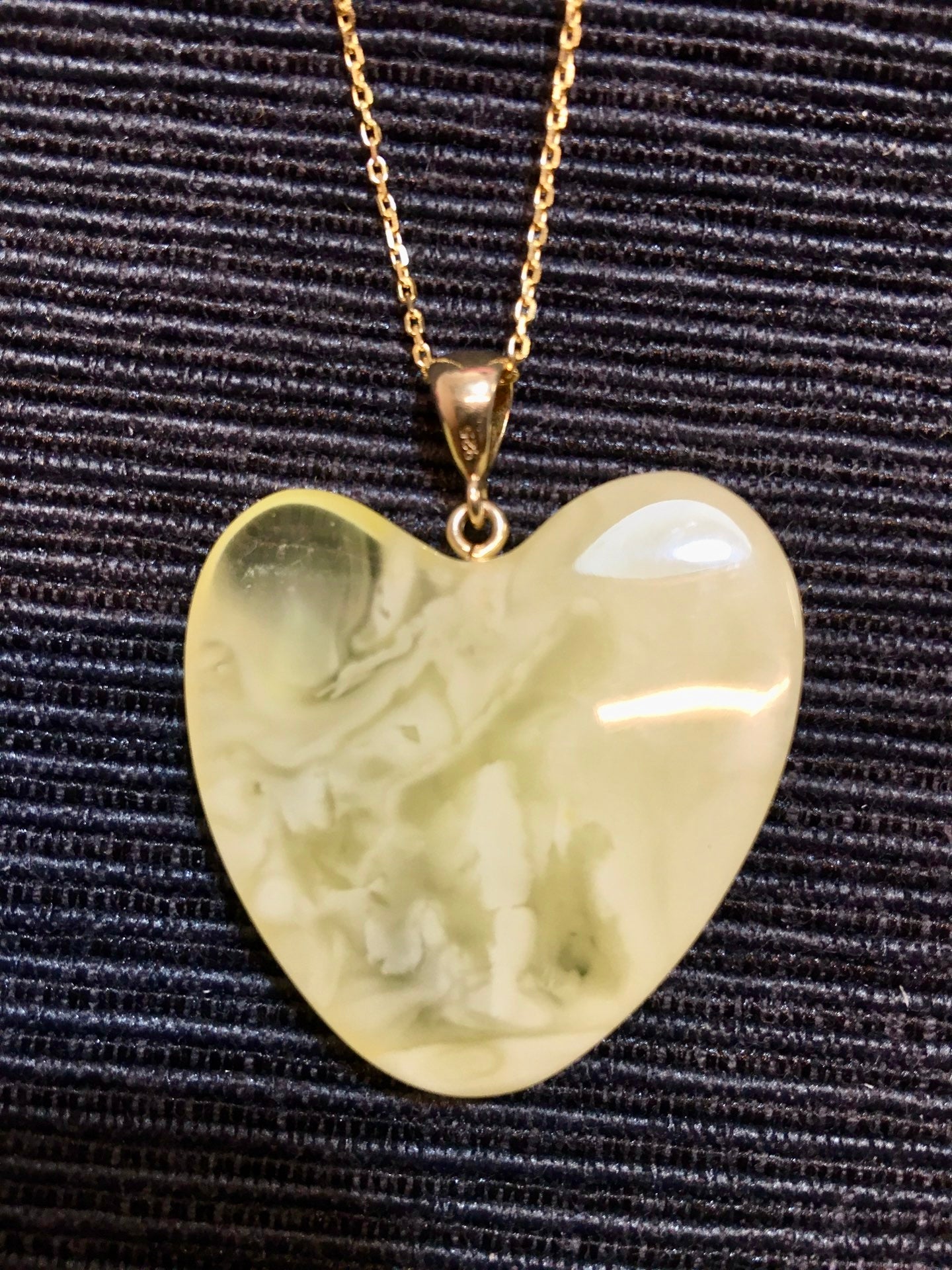 Handmade asymmetrical heart pendant made of genuine Baltic white amber with floating patterns 925 pendant without a chain