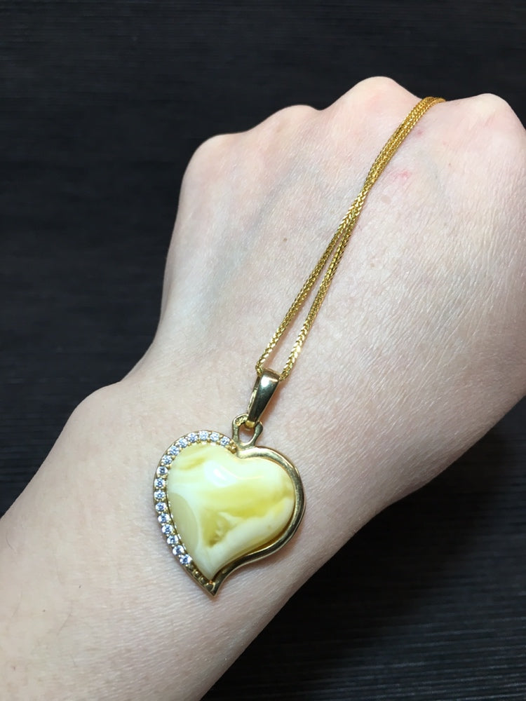 Handmade genuine Baltic natural white amber heart pendant, set in 925 sterling silver plated with gold and inlaid with zircon without a chain