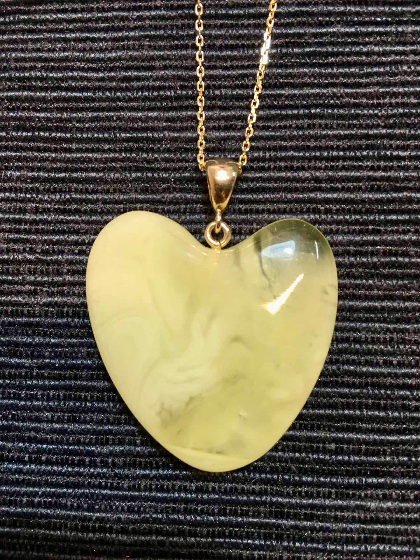 Handmade asymmetrical heart pendant made of genuine Baltic white amber with floating patterns 925 pendant without a chain