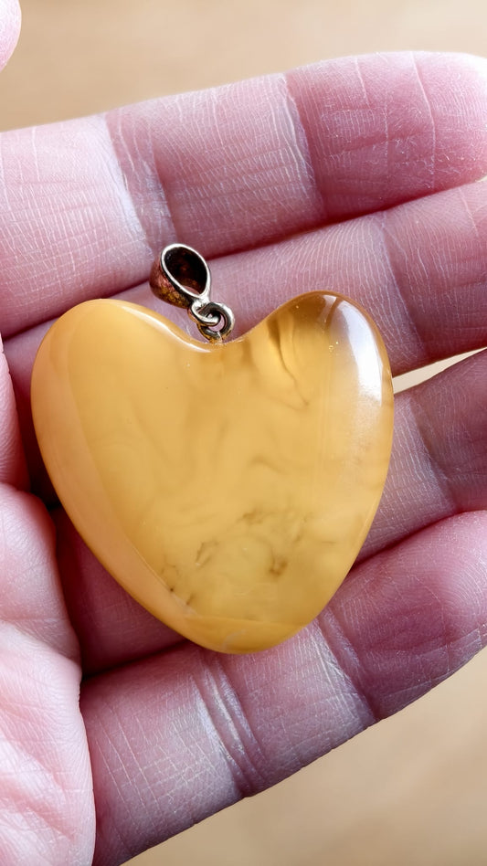 Handmade asymmetrical heart pendant made of genuine Baltic white amber with floating patterns 925 pendant without a chain