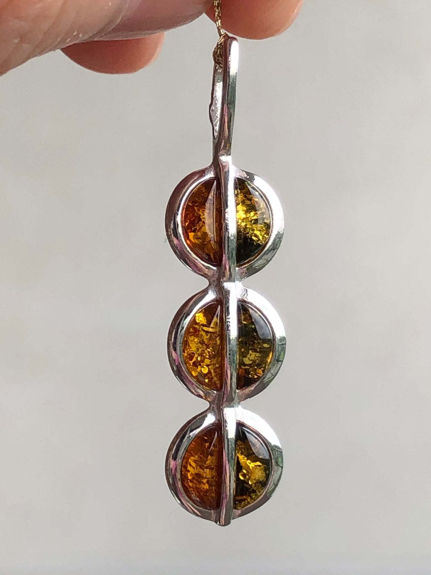 Handmade Baltic natural piebald amber with two-tone 925 sterling silver pendant