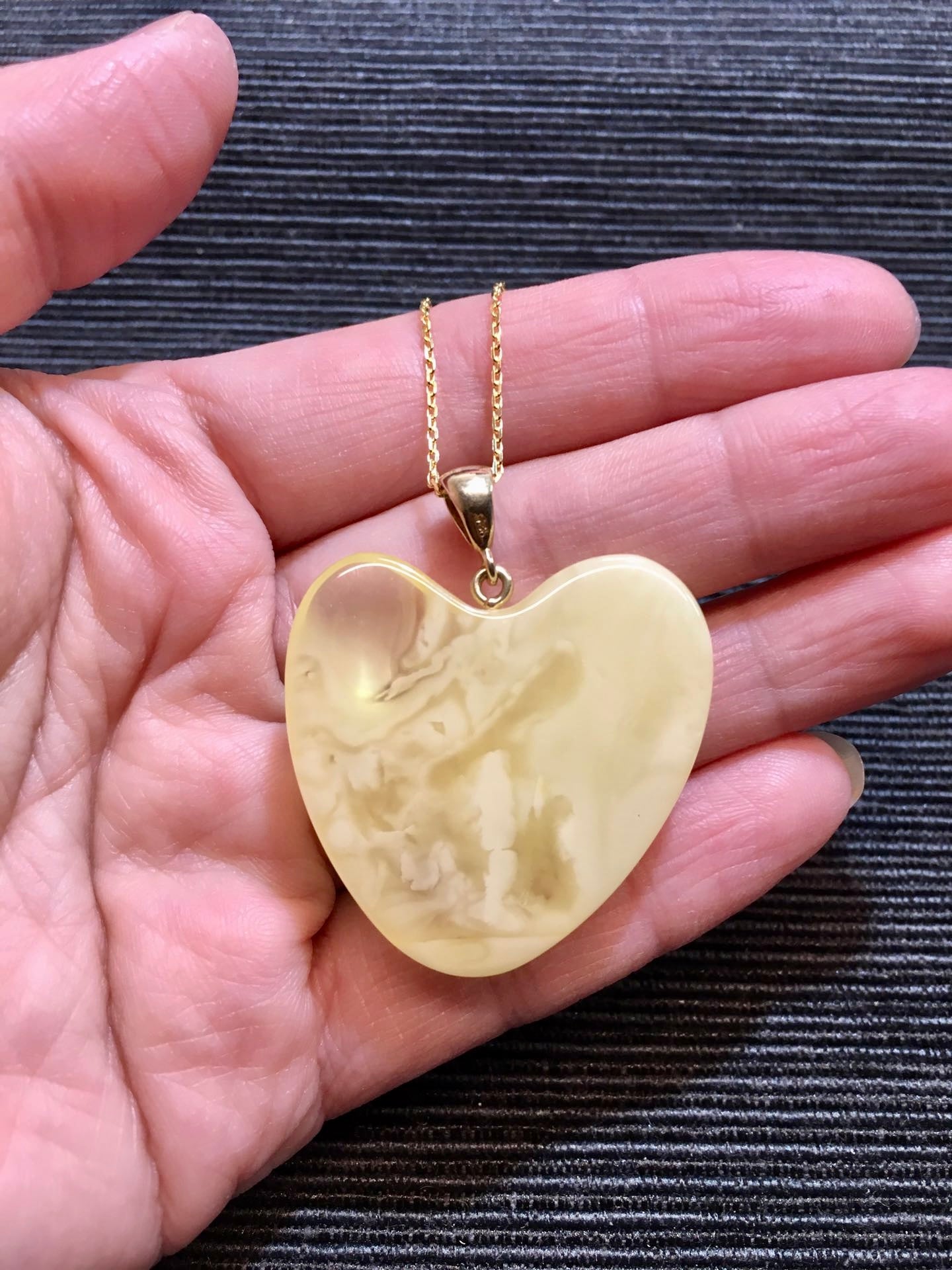 Handmade asymmetrical heart pendant made of genuine Baltic white amber with floating patterns 925 pendant without a chain