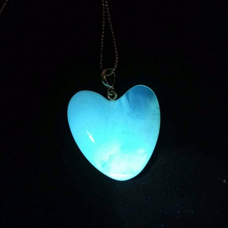Handmade asymmetrical heart pendant made of genuine Baltic white amber with floating patterns 925 pendant without a chain